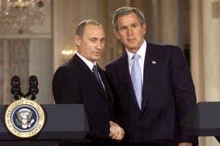 U.S. President George W. Bush (R) and Russian President Vladimir Putin shake hands after speaking with the media in the East Room of the White House November 13, 2001 in Washington, DC.